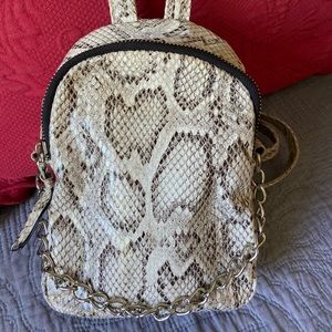Grey snakeskin backpack